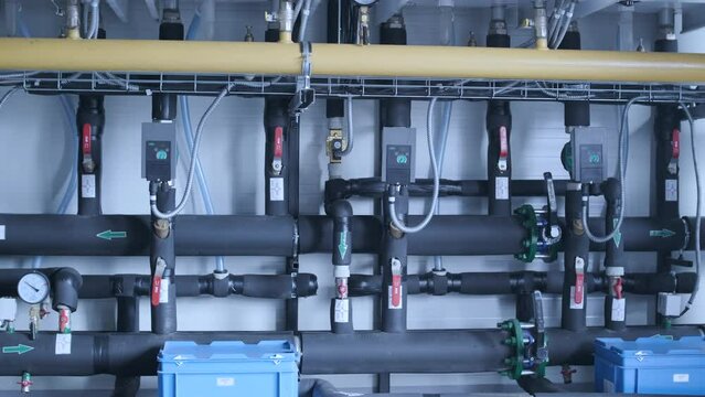 Modern industrial gas boiler room equipped for heating process. Heating gas boilers, pipelines, valves.