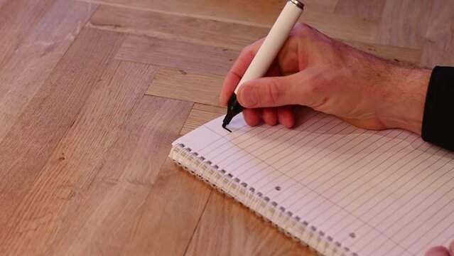 Blank notepad in class on wooden desk for student learning French written language. Française subject for adult learning with handwritten notes and writing exercises for personal development	