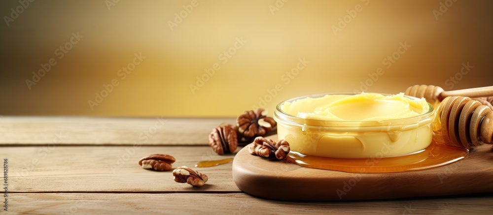 Poster butter board food trend butter spread on wooden board with sweet toppings of honey and pecans. copys
