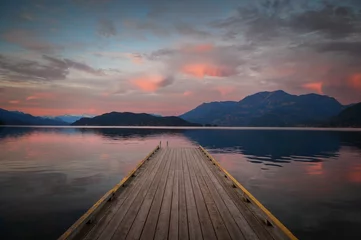 Photo sur Plexiglas Descente vers la plage Sunset with Long Pier Leading Out into Water.  Harrison Lake, BC, Canada area is breathtaking with beautiful coves, beaches and islands, waterfalls, coniferous forests and snow-capped mountains.