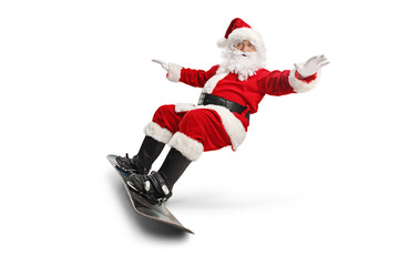 Santa claus riding a snowboard