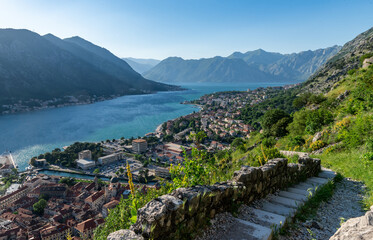 Fototapeta na wymiar Panoramic evening view of the old town and the Bay of Kotor from above. The Bay of Kotor is the beautiful place on the Adriatic Sea. Kotor, Montenegro.