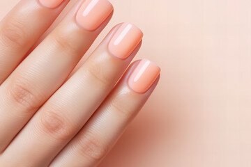 woman hand with perfect peach fuzz color manicure, close up, nail salon ad