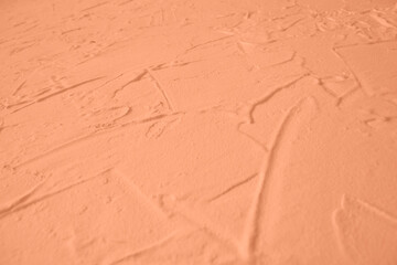 Peach Fuzz toned colour grunge decorative wall background. Art rough stylized texture banner trendy color 2024. Grunge Peach Fuzz color texture