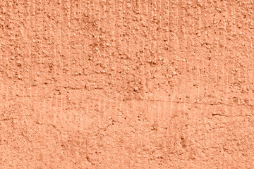 Peach Fuzz toned colour grunge decorative wall background. Art rough stylized texture banner trendy color 2024. Grunge Peach Fuzz color texture