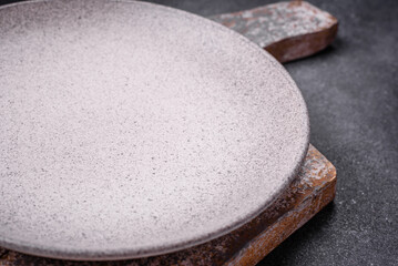 Empty round ceramic plate as an item of kitchen utensils
