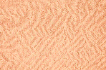 Fototapeta premium Peach Fuzz toned colour grunge decorative wall background. Art rough stylized texture banner trendy color 2024. Grunge Peach Fuzz color texture