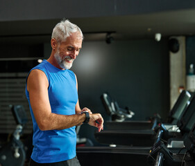 gym sport fitness exercising training mature man running watch smart time smartwatch wristwatch...