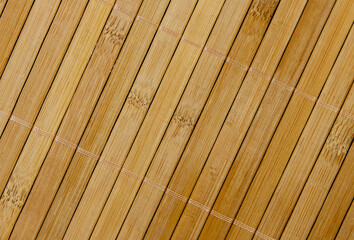 Texture of a wall of bamboo planks with selective focus