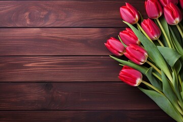 tulips on a red wooden background, empty 