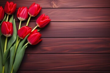 tulips on a red wooden background, empty copy space