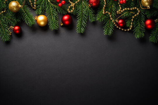 Black christmas flat lay background. Christmas tree with holidays decorations at black background.