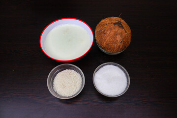 Coconut, Milk, Sugar, and Boiled Rice Artfully Displayed in Separate Containers 