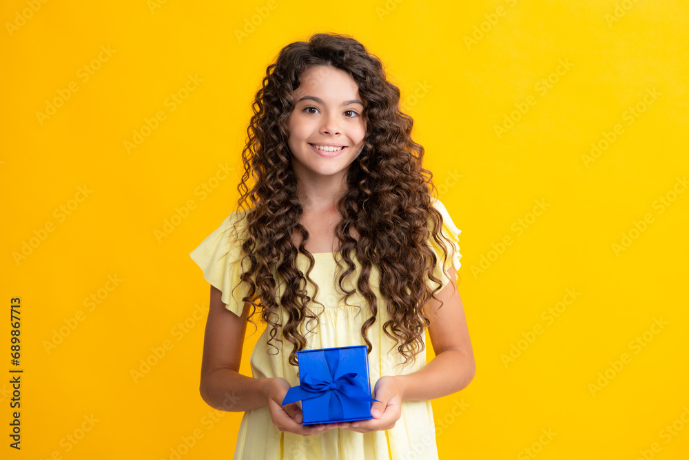 Wall mural happy teenager portrait. teenager kid with present box. teen girl giving birthday gift. present, gre