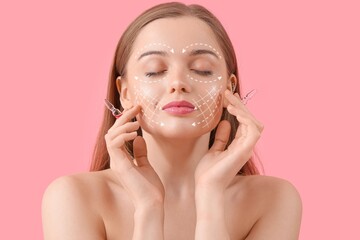 Beautiful young woman with ampules on pink background. Skin care concept
