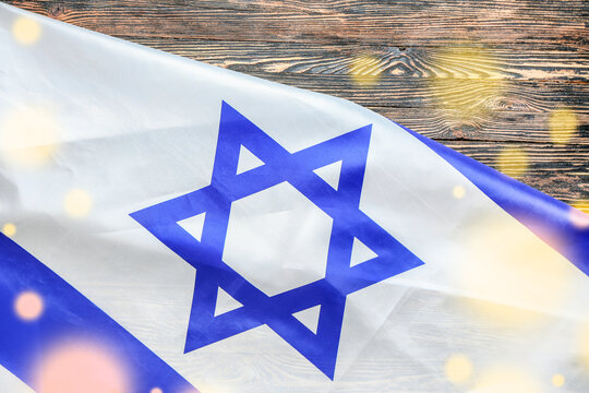 Flag of Israel on wooden background