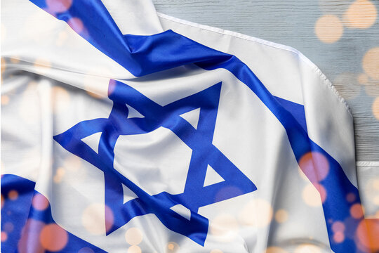 Flag of Israel on grey wooden background