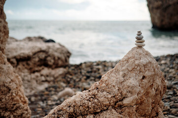 Stacked stones on the beach. Zen, harmony and balance concept. Winter time in Cyprus.