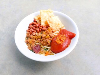 mie ayam. chicken noodle. spiced noodles topped with chopped chicken cooked with spices, peanuts, fried dumplings and bok choy vegetables. savory traditional food
chicken with vegetables.