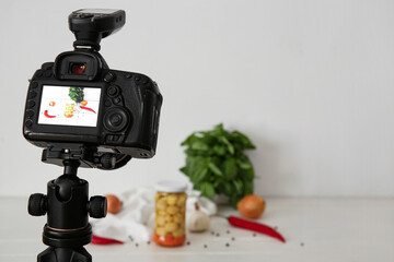 Fresh vegetables on display of professional photo camera in studio