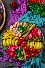 Assorted pickled vegetables on a large platter. top veiw