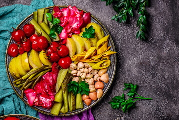 Assorted pickled vegetables on a large platter. top veiw