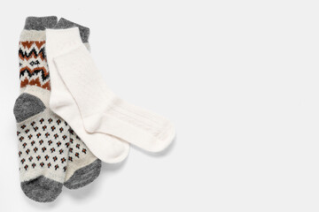 Christmas knitted socks on pink background