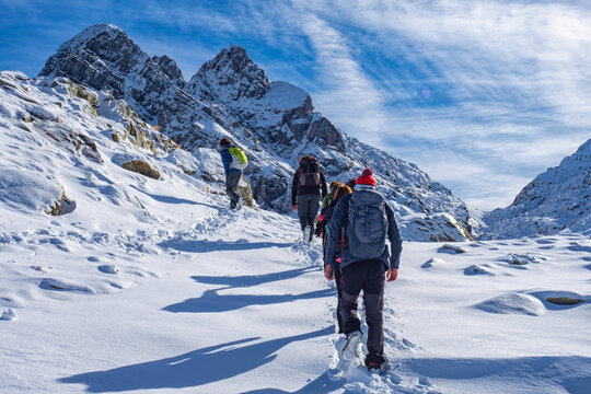 Trekking scene in winter on the italian alps