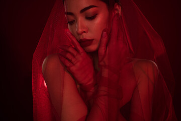 Photo of asian young woman femme fatale touch face teasing sexy bride shoulders off isolated dark...