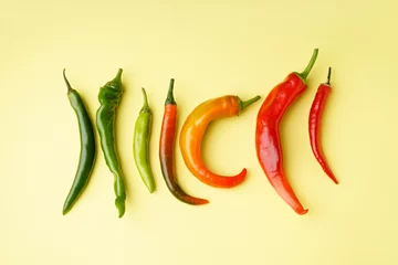 Gardinen Chilischoten Fresh chili peppers on yellow background  © Pixel-Shot