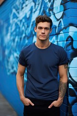 Man in a blue T-shirt against the background of the city