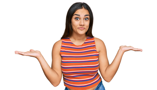 Young brunette woman wearing casual clothes clueless and confused expression with arms and hands raised. doubt concept.