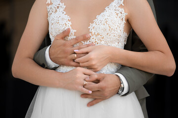 Hands of the bride and groom in wedding rings, wedding ceremony