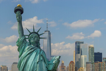 AStatue of Liberty with beautifully Manhattan at New York City background