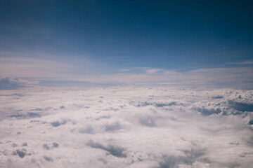 Clouds over the mountains. Aerial view of sky