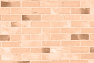 surface of Peach Fuzz textured brick wall background