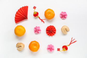 Fortune cookies with mandarins and Chinese symbols on white background. New Year celebration