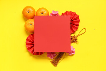 Blank card with mandarins and Chinese symbols on yellow background. New Year celebration