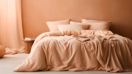 Fototapete Pantone 2024 Peach Fuzz A cozy bedroom with a bed dressed in soft peach fuzz color bedding. Modern trendy tone hue shade