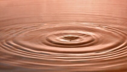 Water ripples in Peach Fuzz color, background with selective focus and copy space