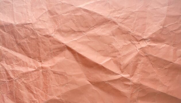 Crumpled paper in Peach Fuzz color, background with selective focus and copy space for text