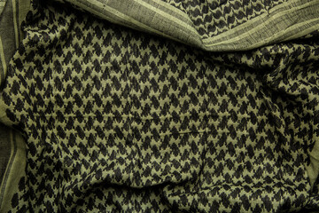 Keffieh scarf. The texture of the cotton traditional symbolic arabian scarf. Khaki back.