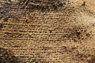 Close up textured abstract background of brown hessian