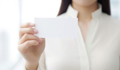 woman holding blank card