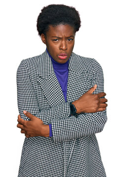 Young african american girl wearing casual clothes shaking and freezing for winter cold with sad and shock expression on face