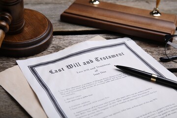 Last will and testament with pen on wooden table - obrazy, fototapety, plakaty