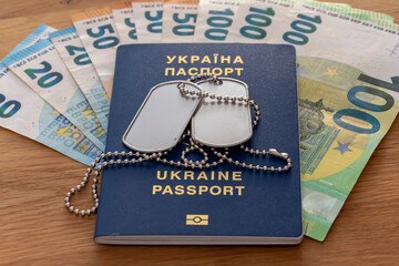 Ukrainian passport, soldier identification badge, euro banknotes.  Concept: corruption in Ukraine,...