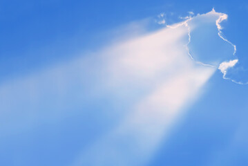 Burst of radiant rays emanates from a cloud, religious and spiritual contexts - 689920582