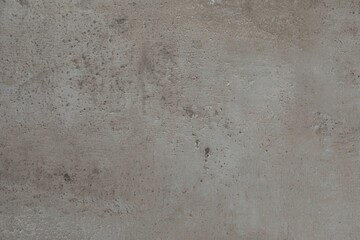 Grey stone surface as background, closeup view