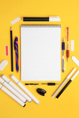 Different school stationery on yellow background, flat lay with space for text. Back to school